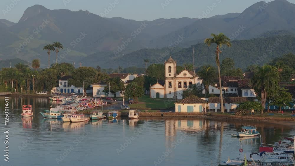 Paraty, a charming historic city, enchants with its preserved stone streets and a marina full of traditional boats, which reflect the rich local maritime culture. Paraty, a charming historic city, enchants with its preserved stone streets and a marina full of traditional boats, which reflect the rich local maritime culture.