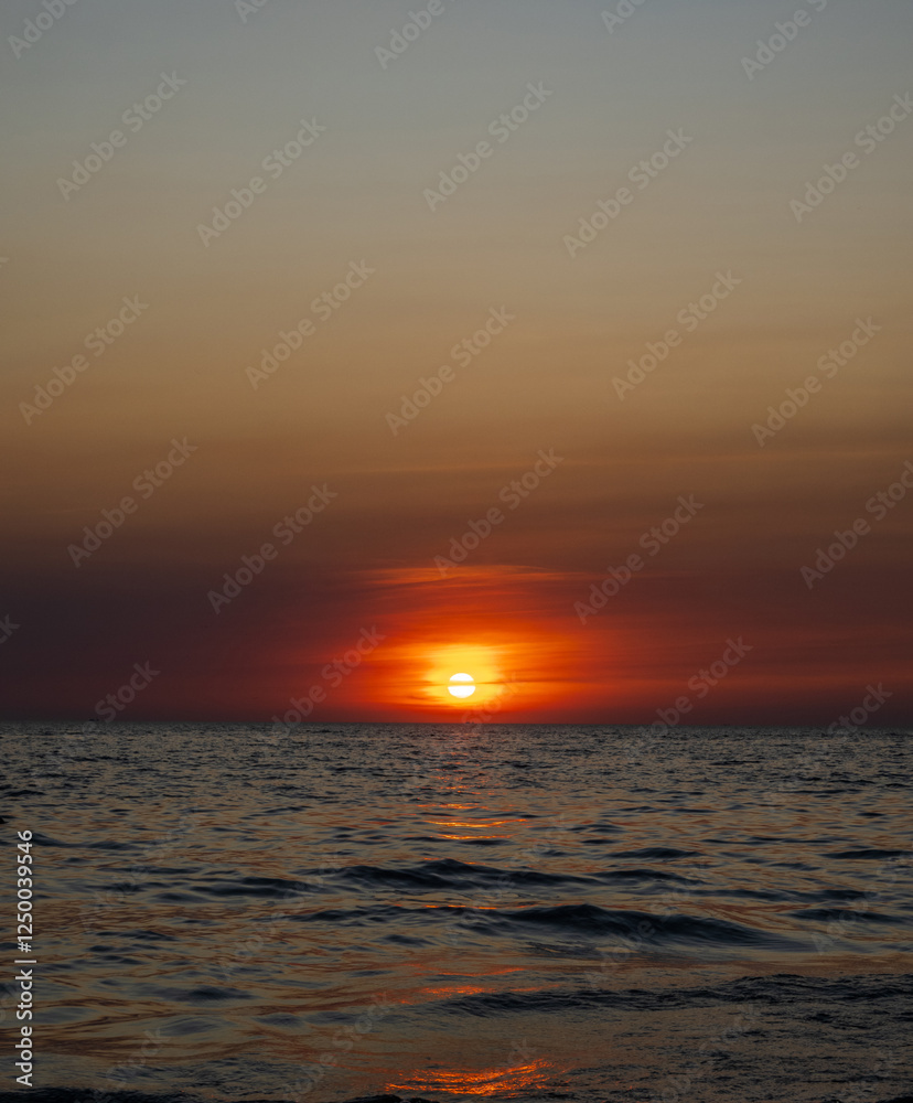Naklejka premium Photography sunset sea vertical high view landscape horizon rock summer season shore nobody wind soft wave cool holiday calm sky twilight evening day time nature tropical coast ocean water travel