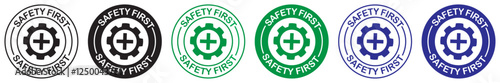 Safety first logo symbol set for factory construction site on white background. Safety first insignia featuring gear and medical cross for industrial hazard awareness. safety first. gear. industrial. 