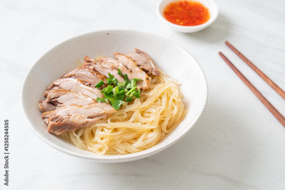 dried noodles with stewed duck in white bowl dried noodles with stewed duck in white bowl