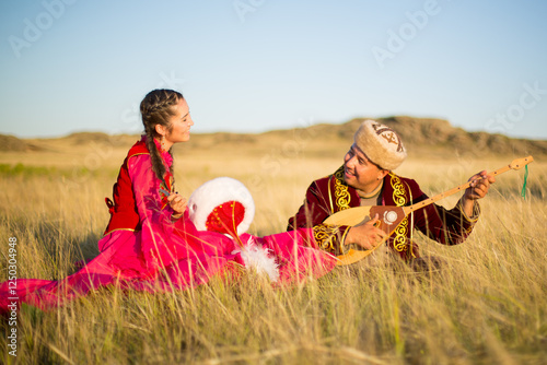 Kazakh woman and man in national costumes photo