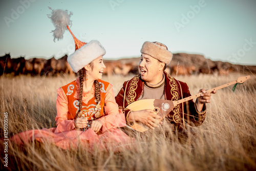 Kazakh woman and man in national costumes photo