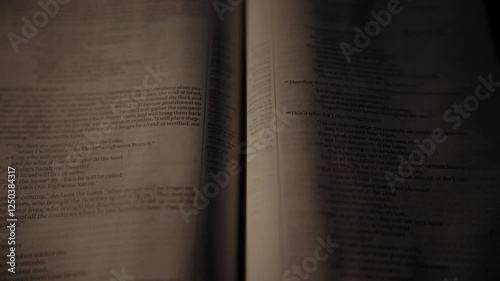 Light rays shining and passing over a christian bible