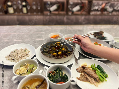 Eating food from top view hand chopsticks.
