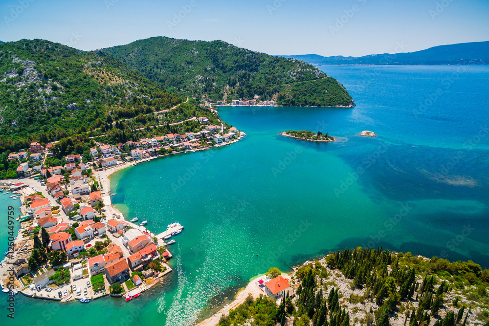 Fototapeta premium Blace Coastal Village Aerial View, Southern Croatia. Stunning Lagoon Surrounded by Scenic Hills and Clear Adriatic Waters