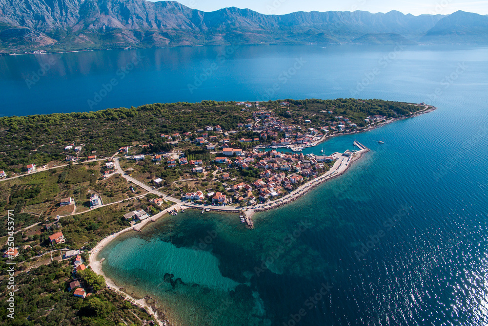 Naklejka premium Scenic Aerial View of Sucuraj Town on Hvar Island, Southern Croatia. Pristine Beaches, Mediterranean Charm, and Adriatic Sea