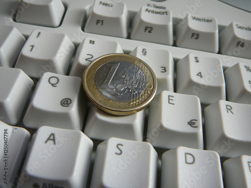 Money lying on a computer keyboard. photo