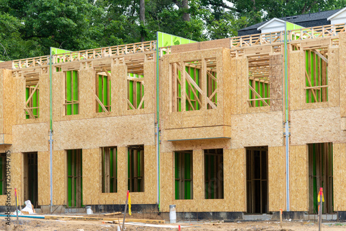 A view of a construction site with row-style housing under development showcasing modern urban planning and affordable housing efforts.