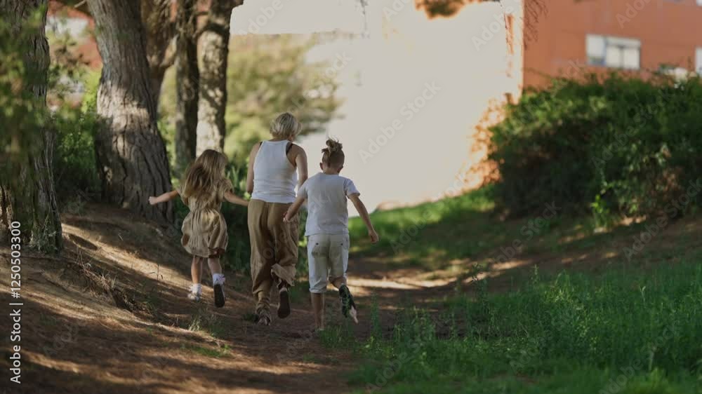 Family strolling together on a sunny forest path Family strolling together on a sunny forest path