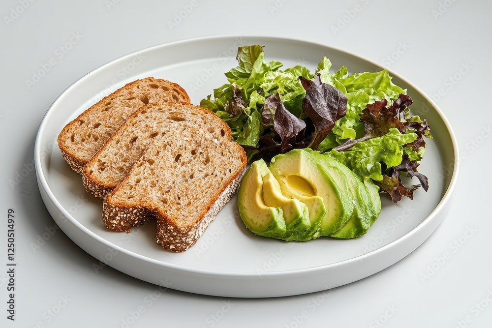 A minimalist arrangement of whole-grain bread slices with creamy avocado halves and a variety of fresh mixed greens, styled on a clean white plate with a neutral background. A minimalist arrangement of whole-grain bread slices with creamy avocado halves and a variety of fresh mixed greens, styled on a clean white plate with a neutral background.