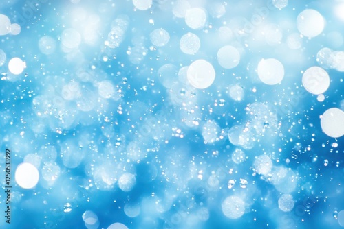 Blurry blue water surface sparkling with bubbles and gentle waves, illuminated by sunlight, perfect for calming backgrounds and nature-themed creative projects
