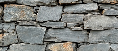 Natural gray stone wall texture ideal for architecture landscaping and interior design projects photo