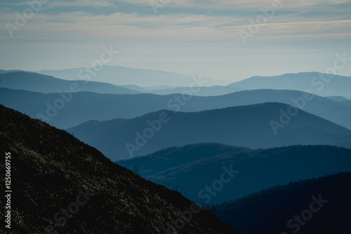 Scenic autumn landscapes from a trekking loop in Bieszczady, featuring views from Tarnica, Halicz, Rozsypaniec, Bukowe Berdo, Połonina Wetlińska, and the Ukrainian Bieszczady under a clear blue sky photo