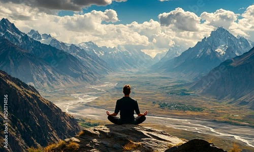 A Person Meditating on a Mountain Surrounded by Nature