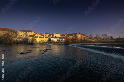 Royal city of Písek. Evening photo of the city. Bridge over the Otava River. Sunset. Quiet evening by the water. Beautiful photo. photo