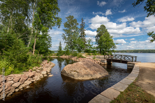 Monrepos Park in Vyborg on a clear sunny day in summer against a blue sky with clouds