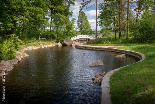 Monrepos Park in Vyborg on a clear sunny day in summer against a blue sky with clouds