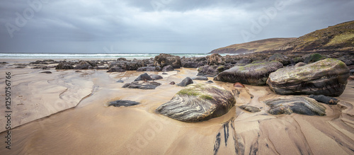 Beautiful patterns and lines and rocks on Stoer Beach, Lairg, Scotland photo