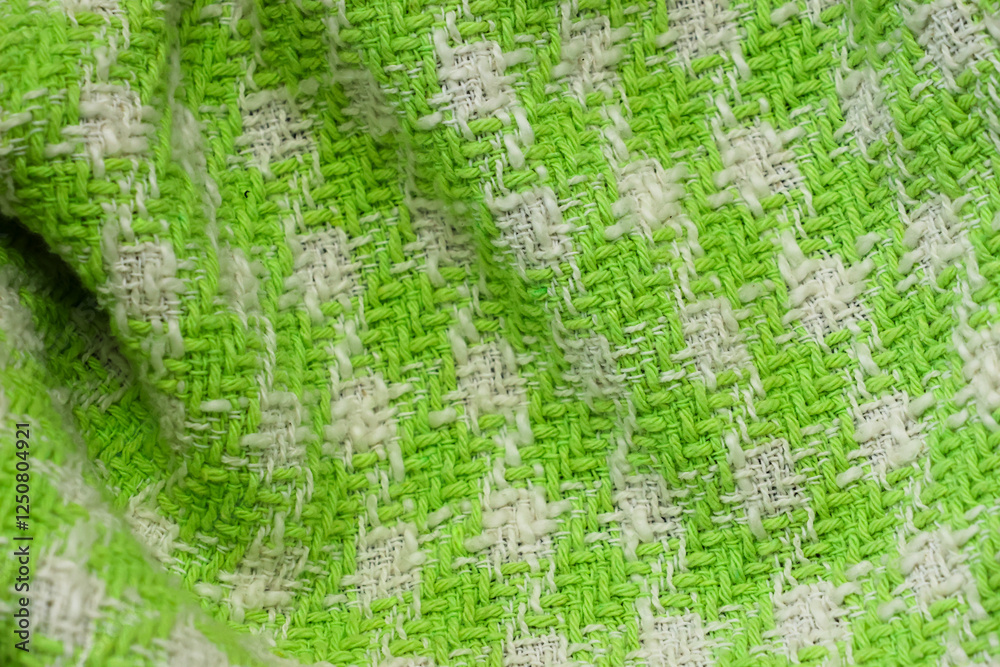 The fabric of a green and white sweater The fabric of a green and white sweater