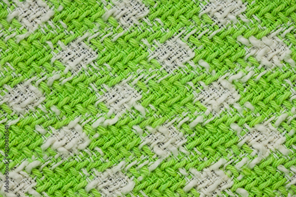 The fabric of a green and white sweater The fabric of a green and white sweater