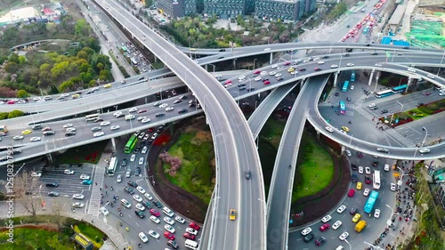 Dynamic aerial view of Nanjing Xinzhuang overpass showing busy traffic patterns during peak hours