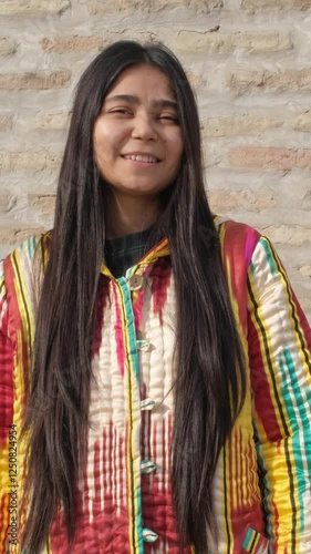 Uzbek female wearing traditional attire, her stylish appearance a nod to her rich cultural background.