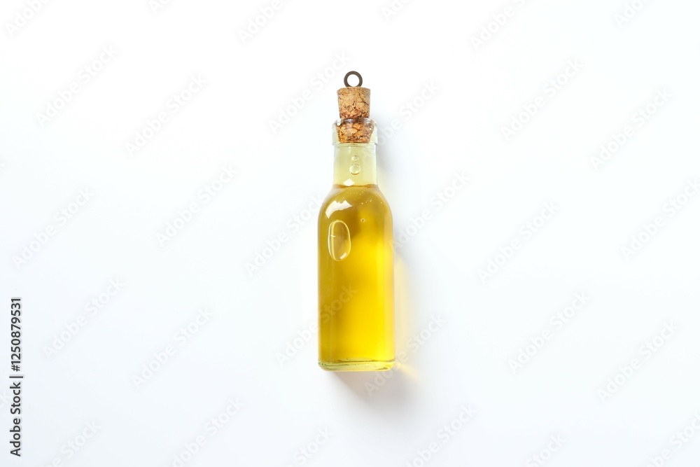 Fototapeta premium Bottle of fresh oil on white background