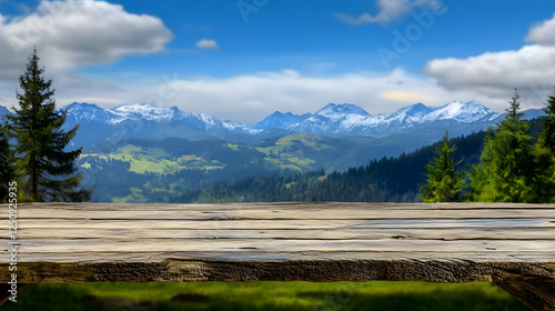 A natural wooden table stands against a backdrop of snow-capped mountains and lush greenery, ideal for product placement or nature scenes