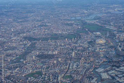 Obraz na płótnie Aerial view of London through early morning clouds with Thames river flowing at golden hour sunrise near Tower Bridge w salonie