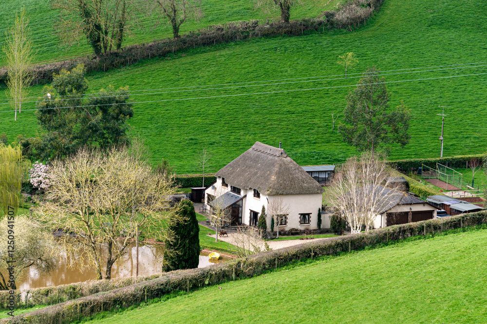 A small settlement on the slopes and meadows of Devon, England, Europe. A small settlement on the slopes and meadows of Devon, England, Europe.