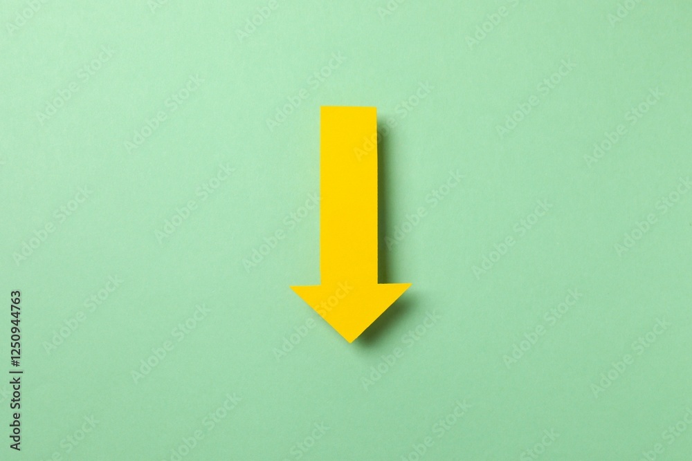 Paper arrow on color background, top view Paper arrow on color background, top view