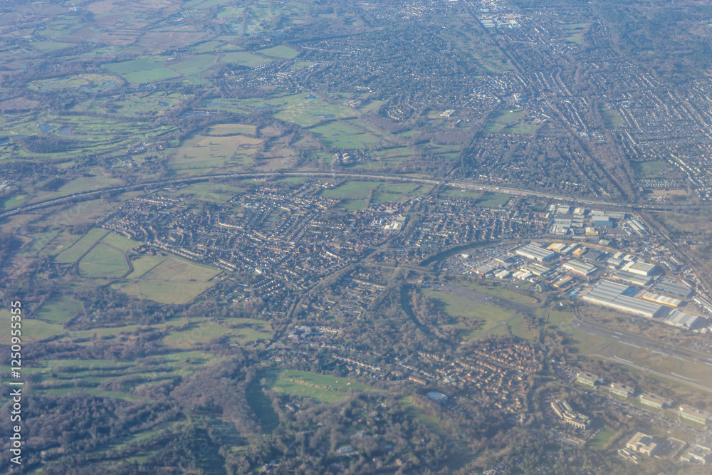 Aerial view of London outskirts suburbs from an aeroplane window