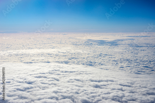 Obraz na płótnie View of clouds from airplane window, clouds in a blue sky w salonie