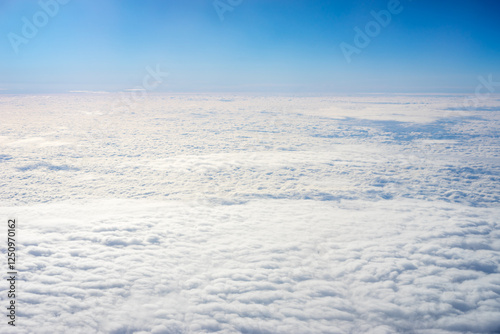 Obraz na płótnie View of clouds from airplane window, clouds in a blue sky w salonie