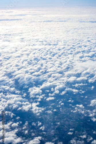 Obraz na płótnie View of clouds from airplane window, clouds in a blue sky w salonie