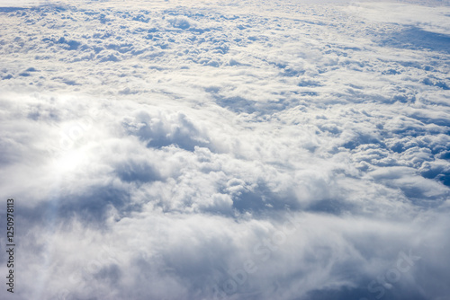 Obraz na płótnie View of clouds from airplane window, clouds in a blue sky w salonie