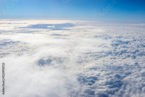 Obraz na płótnie View of clouds from airplane window, clouds in a blue sky w salonie