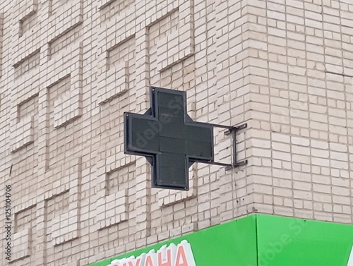 cross on a brick wall