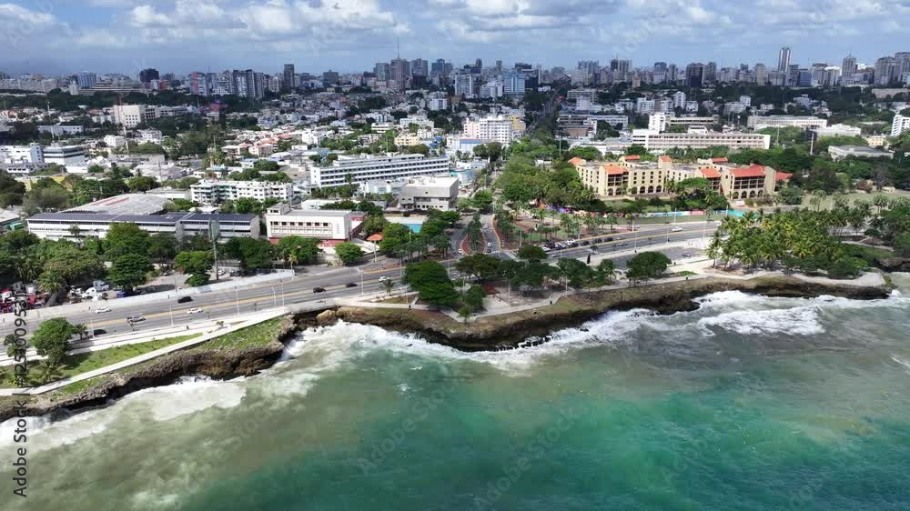 Santo Domingo, Dominican Republic, westbound flight from Rodo Park along shoreline and  Av. George Washington (Malecón) until Monument to the Heroes of Constance, 4k aerial video footage