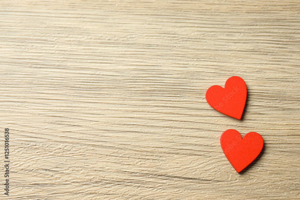 Valentine's Day. Paper hearts on wooden background, top view. Space for text Valentine's Day. Paper hearts on wooden background, top view. Space for text