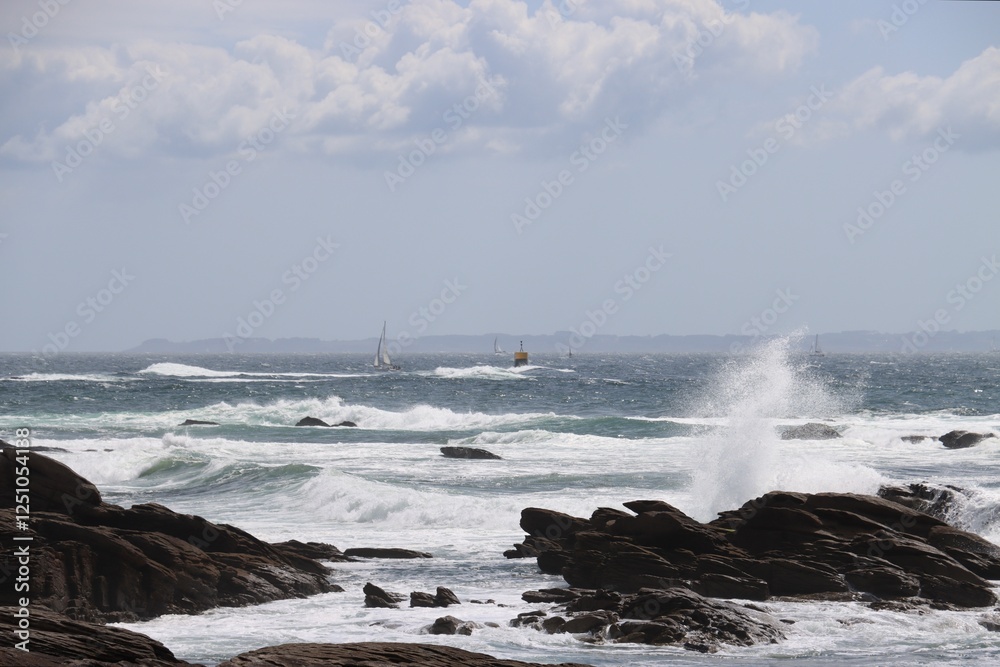 waves crashing on rocks in Quiberon, France