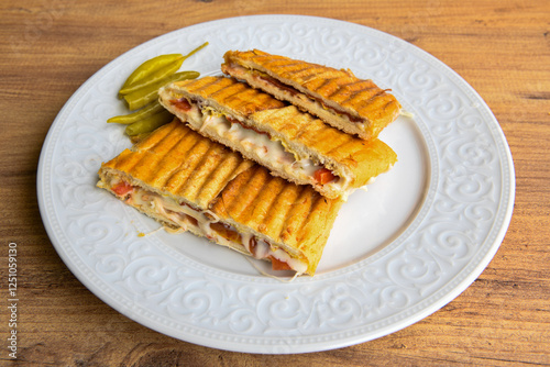 Turkish karisik atom Ayvalik tost ( kasarli bazlama tost) . Sucuklu, Kasarli, kavurmali karisik tost. Flat baked bread toasted. Karisik bazlama tost .   photo