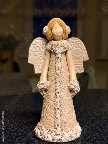 The angel symbolizes love, care and protection. Plaster angels can be found in homes all over the world. photo