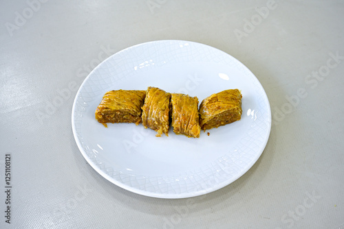 Turkish Dessert Sobiyet, havuc dilimi, midye baklava, mussels baklava and classic baklava with Pistachio . Cikoltali cevizli, fistikli soguk Baklava, top view. photo