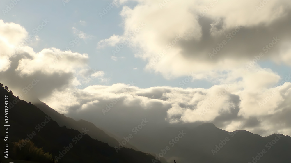 Cloudy sky over mountain range; nature scene; backdrop for travel/adventure