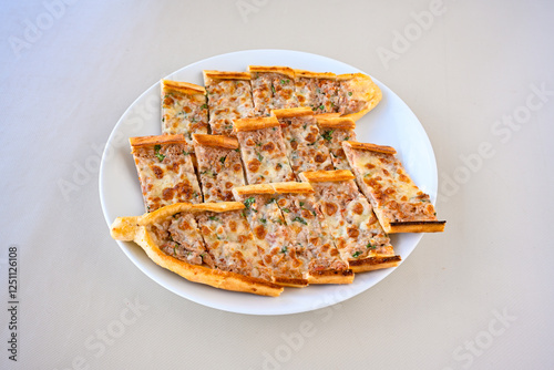 Kiymali pide.Turkish pide with minced meat. Turkish pizza mince pita Pide on white . Etli ekmek.Kusbasi kasarli, kiymali kasarli, kiymali yumurtali, Bafra, Trabzon, Kusbasili pide. Urfa acili lahmacun photo