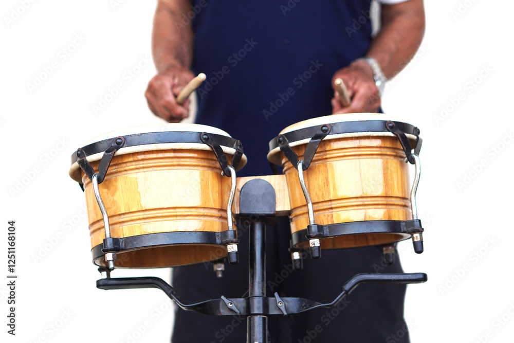 Fototapeta premium Close up man is beating the bongo drums. Concept, musical percussion instrument for rhythm of music to make more fun for performing or dancing. Beat drum with rhythm along music and songs.