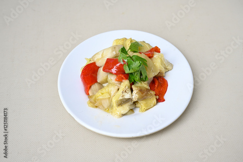 Grilled eggplant paste appetizer on white background .Healthy food. Turkish name koz patlican ezmesi. Koz patlican, koz kirmizi biber kapya salatasi. photo