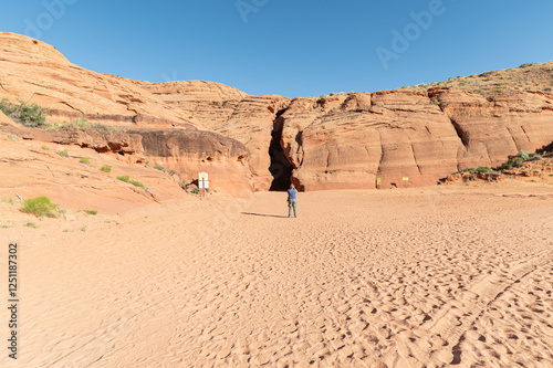 Photographer (unrecognizable) at the entrance of Navajo Upper  Antelope Canyon, Lechee, Arizona, USA