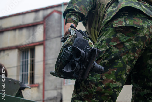 Colombian soldier with tactical helmet and night vision, military personnel with night vision goggles and tactical gear, Colombian army soldier wearing tactical helmet and NVG, armed soldier with photo